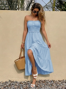 Detail of light blue tiered maxi dress featuring a smocked bodice and bohemian ruffles