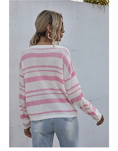 Detail showing pink and white striped knit texture and ribbed cuffs of the sweater