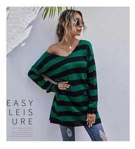 Detail view of green and black striped knit sweater with distressed ripped hole accents