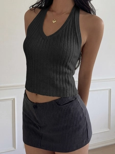 Detail of dark grey ribbed halter top featuring a V-neck and cropped slim fit design