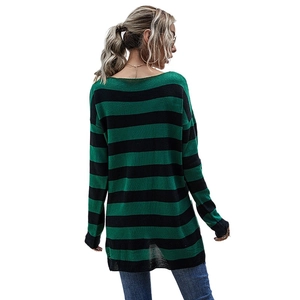 Women's oversized green striped knit sweater with distressed details and long sleeves