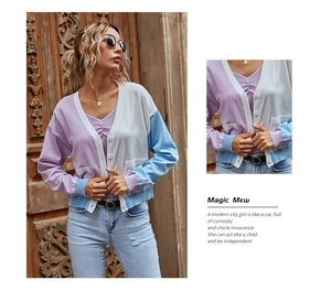 Close-up of color-block knit cardigan with purple, white, and blue panels and buttons