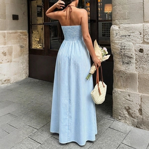 Blue striped halter maxi dress with smocked open back and flowy A-line summer silhouette