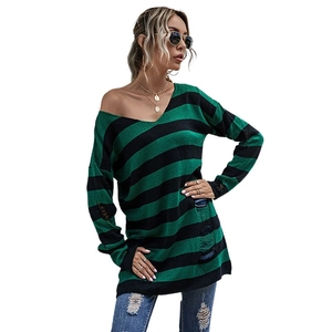 Oversized green and black striped knit sweater with distressed ripped details and V-neckline
