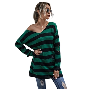 Women's V-neck green and black striped oversized knit sweater with distressed rip details