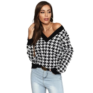 Stylish V-neck houndstooth knit sweater for women with black ribbed trim and loose fit