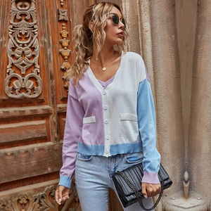 Women's V-neck knit cardigan with purple and white color block panels and button front