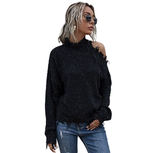Confetti knit black sweater featuring cold shoulder cutout and mock neck street style