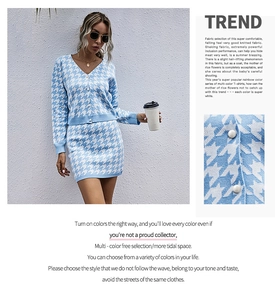 Detailed view of blue houndstooth knitted texture and white button on the cardigan