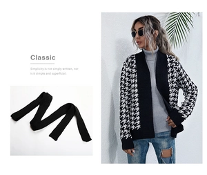 Close-up detail of the classic houndstooth knit cardigan with a black waist tie belt