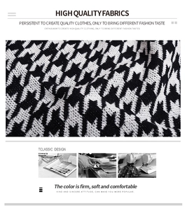Detail of high-quality black and white houndstooth knit fabric with soft texture