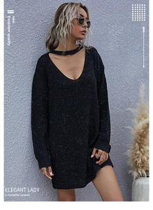 Detail of the deep V-neck choker design on a black colorful knit sweater dress