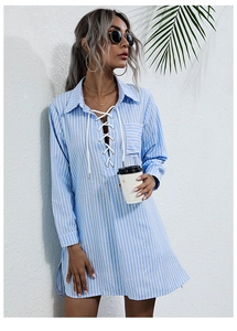Outdoor shot showing details of the blue striped long sleeve shirt dress with lace-up collar