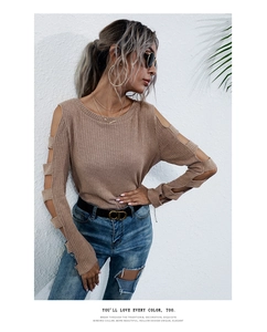 Detailed view of camel cold-shoulder knitted sweater featuring hollow-out sleeve design
