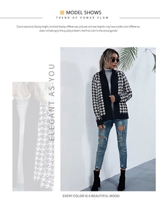 Detail view of stylish black and white houndstooth knit cardigan with a trendy belted waist