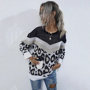 Loose knit leopard print sweater with round neck and black colorblock paneling