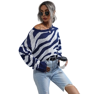 Zebra print crewneck knit sweater with drop shoulder and rolled hem detail