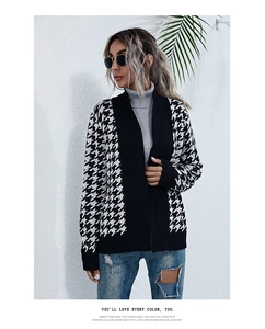 Close-up of the chunky knit texture and houndstooth pattern on the women cardigan