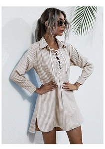 Detailed view of the lace-up neckline and striped pattern on this casual shirt dress