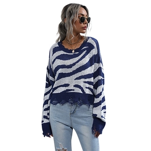 Women's zebra pattern knit sweater with distressed edges in blue and white colors