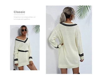 Detail view of cream knit V-neck dress with black stripes and cable knit texture