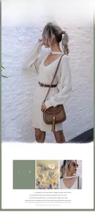 Detail of elegant beige knit dress showing deep V-neck halter and woven texture