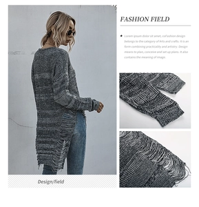 Close-up of gray melange knit sweater featuring distressed hollow-out hem and side fringe