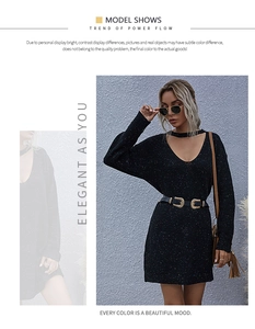 Chic long black knit dress featuring a deep V-neck and stylish neck strap detail