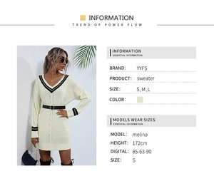Detail of elegant V-neck knit sweater dress with contrast black stripes on neck and cuffs