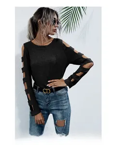 Detail view of the hollow-out cut on long sleeves of this slim-fit knit sweater for women