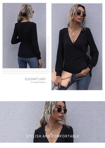 Detail view of black V-neck wrap top showing ribbed knit texture and waist tie detail