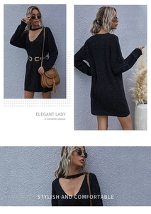 Detail of elegant black knit dress with V-neckline cutout and colorful flecked texture