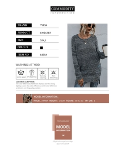 Detail of distressed ripped hem and fringe design on women's grey oversized sweater