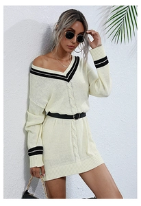 Detail of V-neck knit dress with contrast stripes, cable texture and black buckled belt