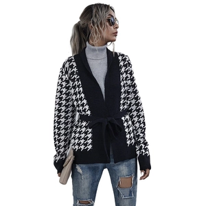 Houndstooth knit cardigan with V-neck and waist tie on a clean white background