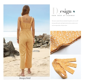 Detail of yellow floral jumpsuit with ruffle back design and matching waist belt