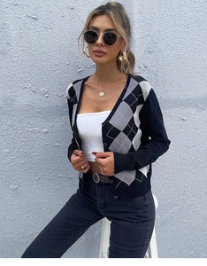 Close-up of navy and gray argyle knit sweater cardigan with V-neck and button closure