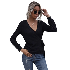Slim fit black V-neck wrap top with long sleeves and side tie waist in rib knit fabric