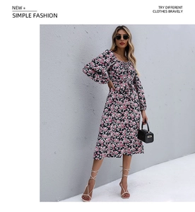Close-up of floral print pattern on a black long sleeve square neck pleated midi dress