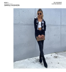 Detailed view of women's argyle V-neck knit cardigan with retro slim fit design