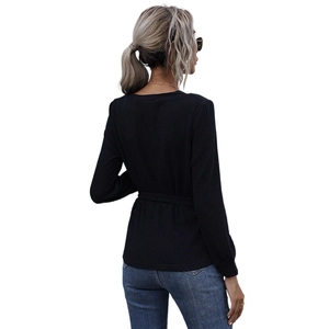 Slim fit black long sleeve top with ribbed texture and back tie detail for women