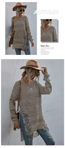 Detail of distressed ripped hollow out knit sweater with fringe hem in autumn brown