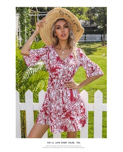 Close-up of red leaf print V-neck dress with flare sleeves and elegant waist tie