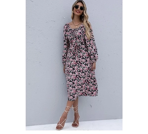 Detail of square neckline and floral print on long sleeve dress with ruffled bodice