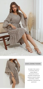 Detail of leopard print midi dress featuring stylish bell sleeves and matching waist belt