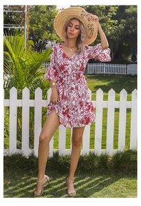 Detailed V-neck and ruffled sleeves on white floral mini dress with red leaf print