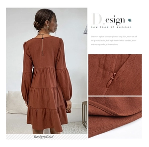 Detail view of cotton linen tiered dress with back zipper and textured stitching