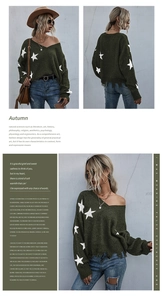 Detail of dark green V-neck knit sweater featuring white stars and fringe hem tassels