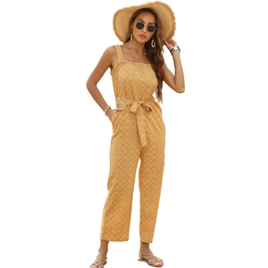 Summer yellow floral jumpsuit for women with spaghetti straps and ruffle neckline detail
