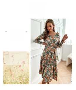 Detailed view of the floral long sleeve dress with square neckline and waist tie design